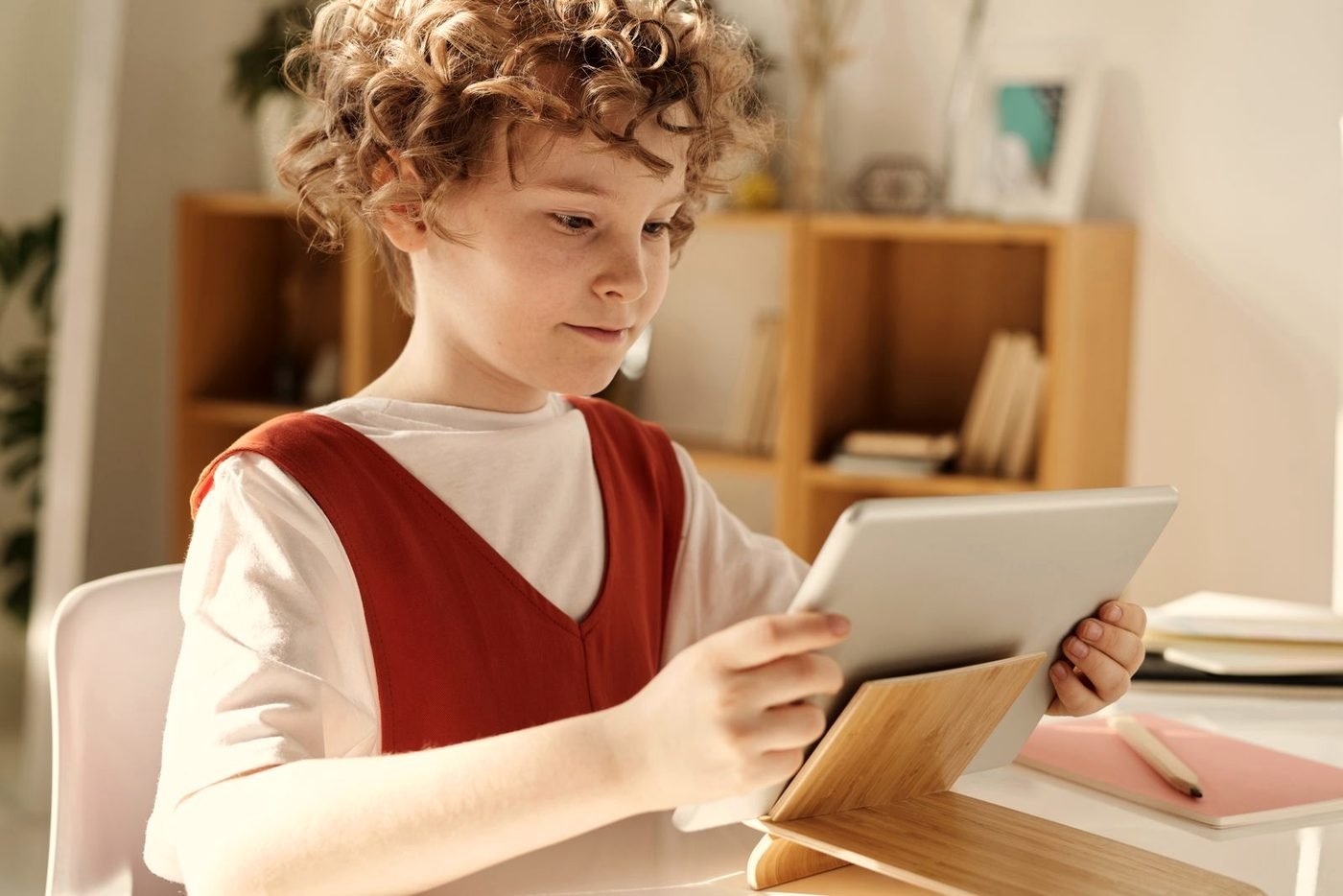 A student reviewing notes on a tablet