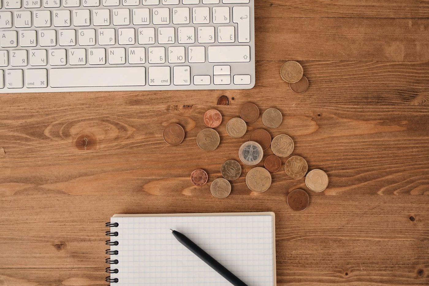 An invoice and calculator on a desk