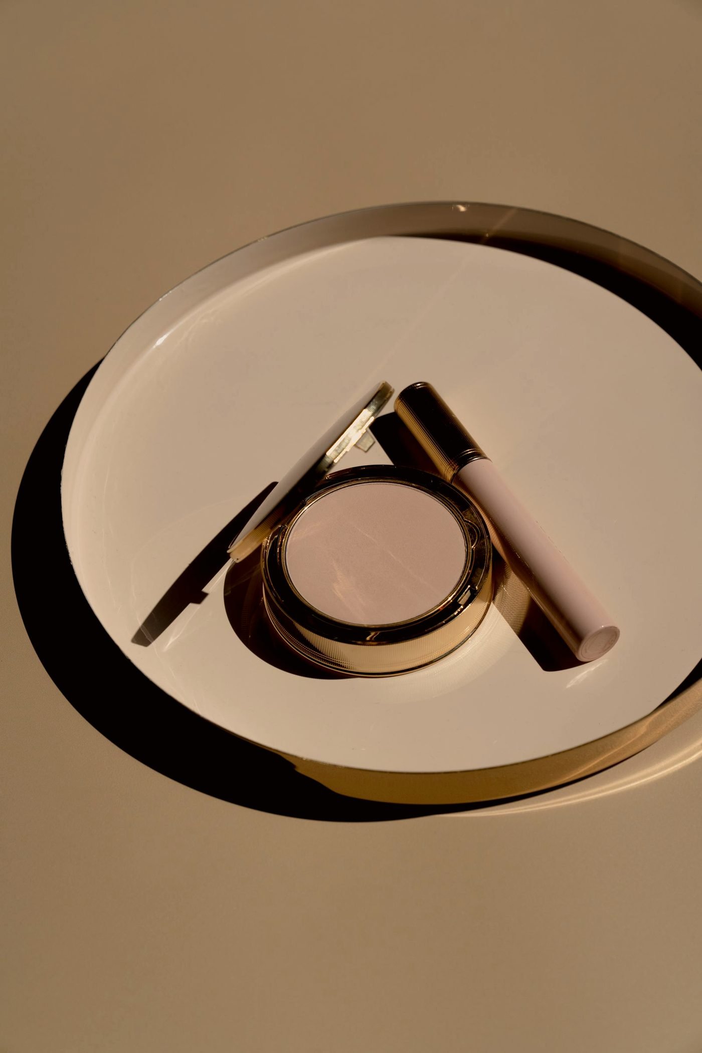 Luxury beauty and self care products arranged on a warm surface