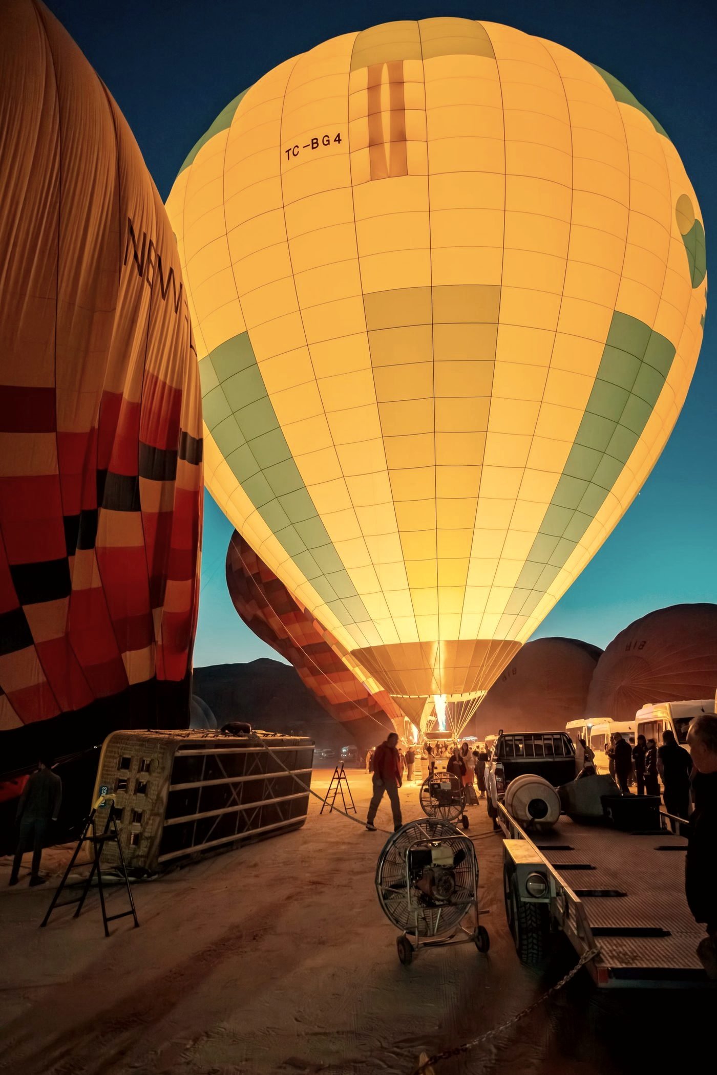 Hot air balloons rising over the rock valleys of Cappadocia at sunrise
