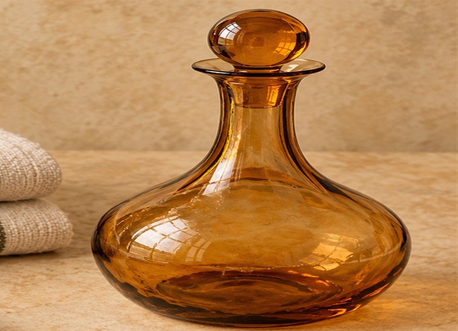 Illustrative amber glass decanter for The Macklowe maker listing