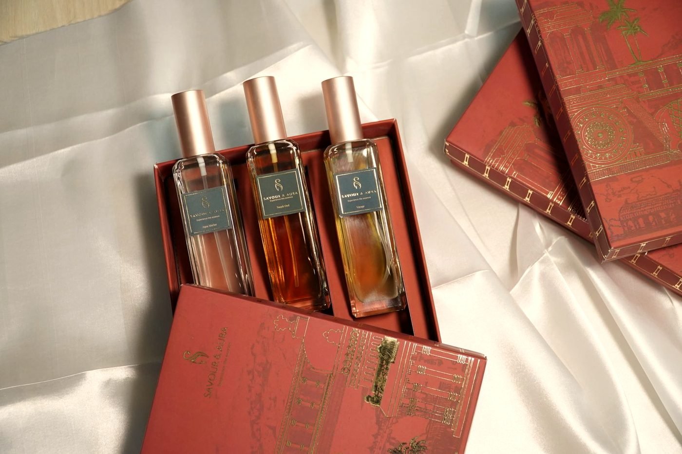 Perfume bottles resting on folded silk