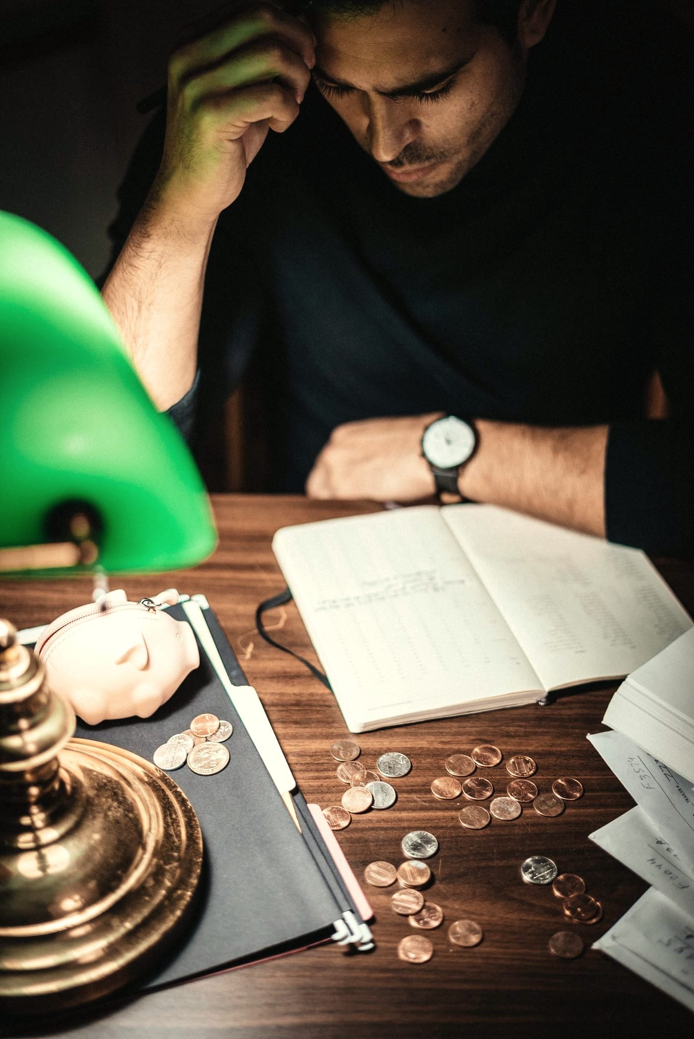 An open notebook and pen on a warm desk