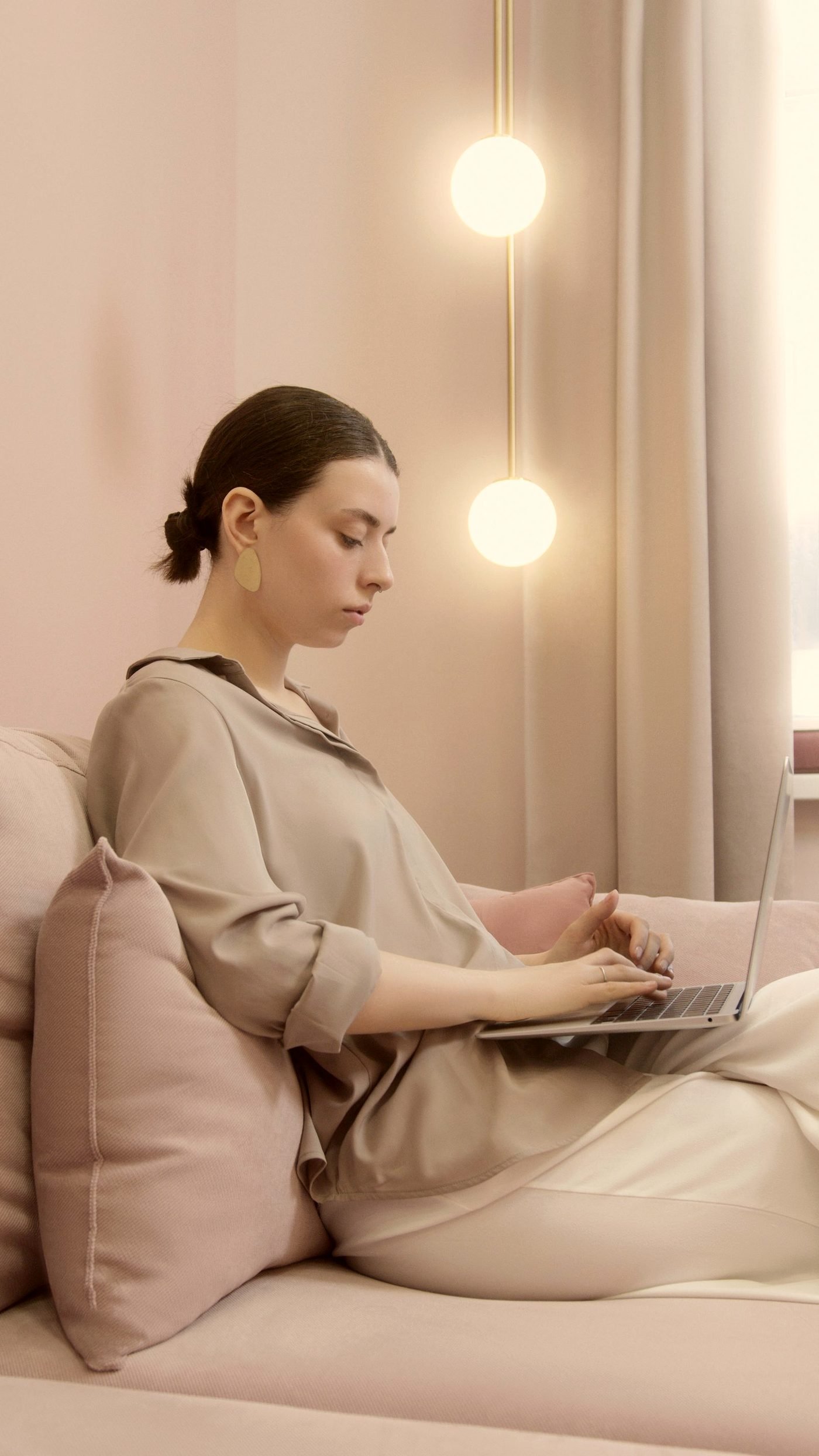 A laptop and coffee on a warm desk by a window